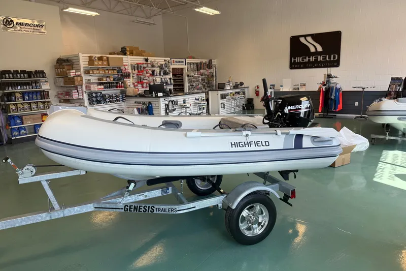 Slide: The Image of 2025 Highfield Classic 290 inflatable boat on Genesis trailer in showroom. - 5