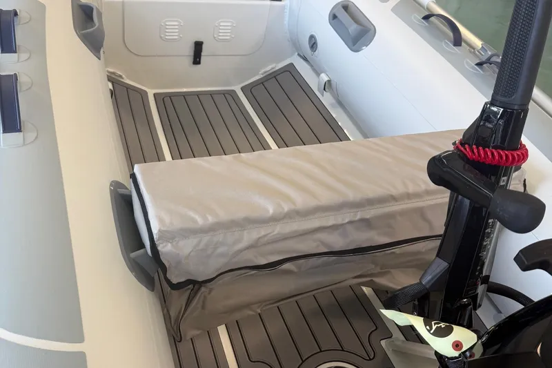 Slide: The Image of Interior of 2025 Highfield Classic 290 boat with cushioned seating and modern design. - 6