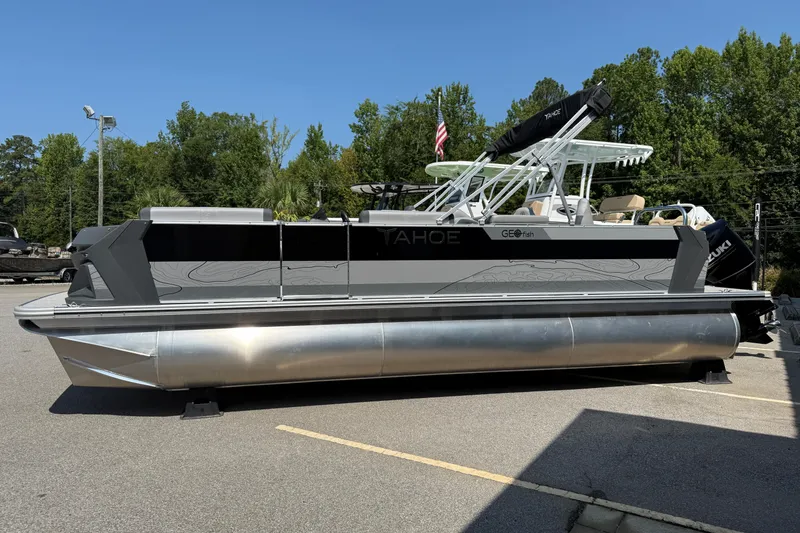 The Image of 2026 Tahoe Pontoon Geofish RF boat displayed outdoors, featuring sleek design and modern amenities. - 0