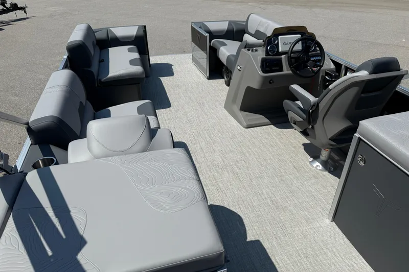 Slide: The Image of 2026 Tahoe Pontoon Geofish RF interior with modern seating and steering console. - 2