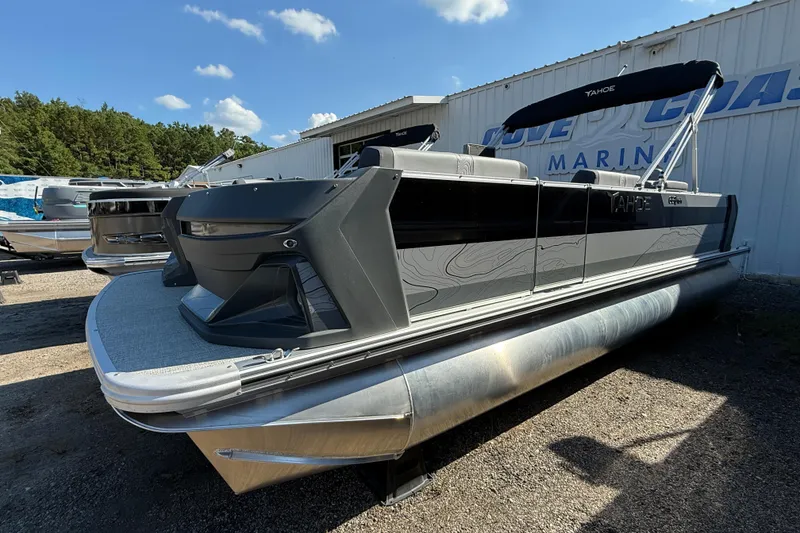 Slide: The Image of 2026 Tahoe Pontoon Geofish RF boat with sleek design, parked outdoors. - 4