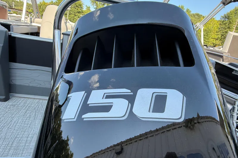 Slide: The Image of Close-up of a 2026 Tahoe Pontoon Geofish RF engine with "150" marking. - 6