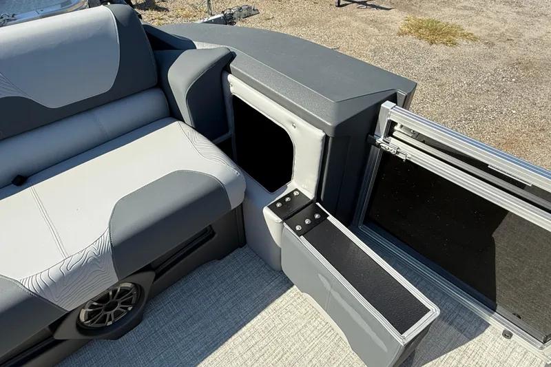 Slide: The Image of 2026 Tahoe Pontoon Geofish RF interior seating and storage compartment. - 9