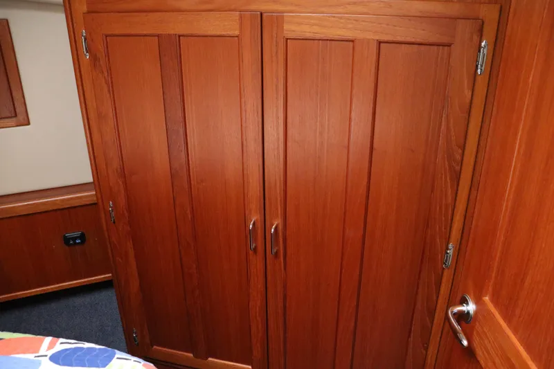 Slide: The Image of Wooden interior cabin doors on a 2003 American Tug 34 boat. - 53