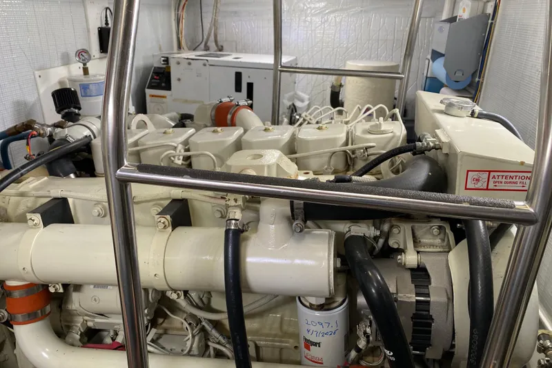 Slide: The Image of Engine room of a 2003 American Tug 34, showcasing detailed mechanical components. - 65