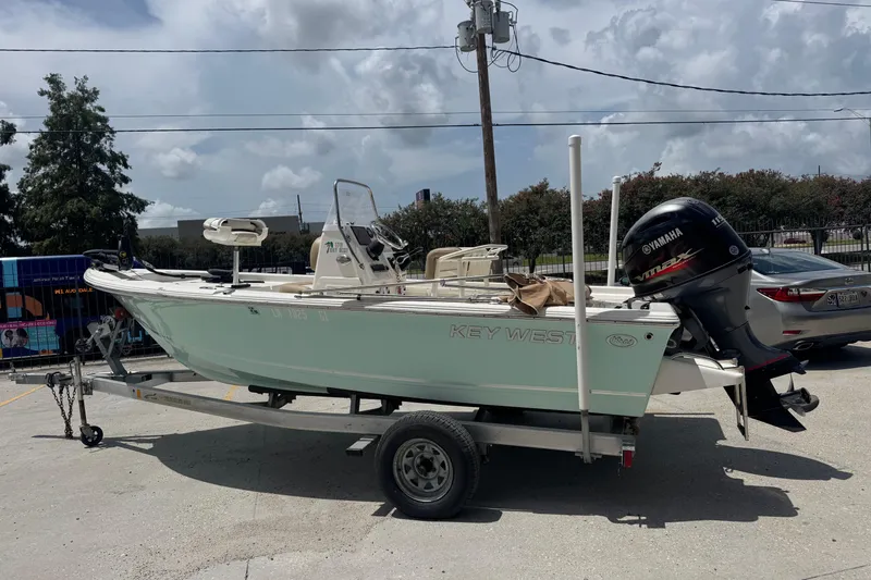 Slide: The Image of 2018 Key West 176 Bay Reef boat on trailer with Yamaha outboard motor. - 2