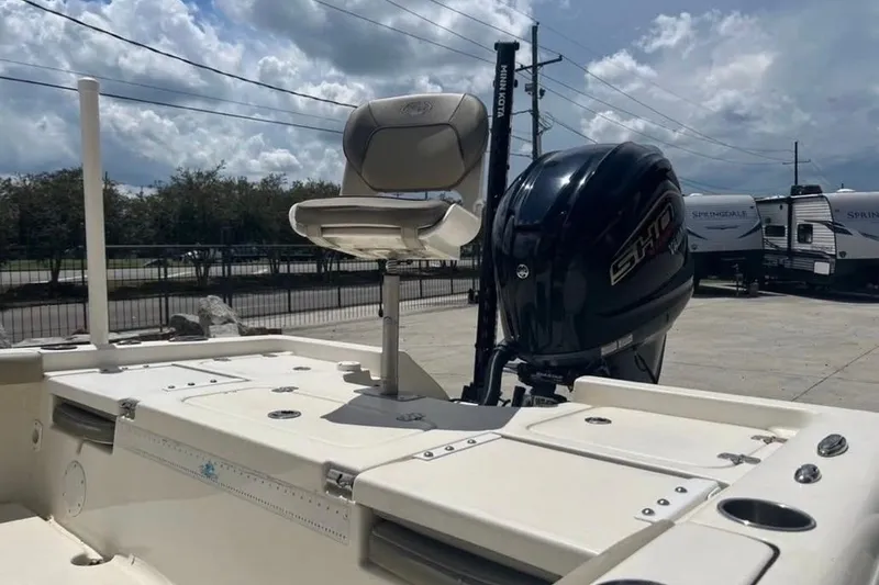 Slide: The Image of 2018 Key West 176 Bay Reef boat with outboard motor and seating. - 5