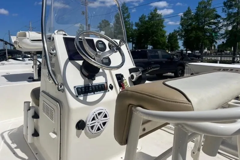 Slide: The Image of 2018 Key West 176 Bay Reef boat console with steering wheel and seating. - 6