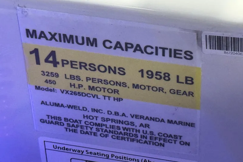 Slide: The Image of Capacity label for Veranda VX265DCVL, 2026 model, 14 persons, 1958 lbs, 450 HP motor. - 10