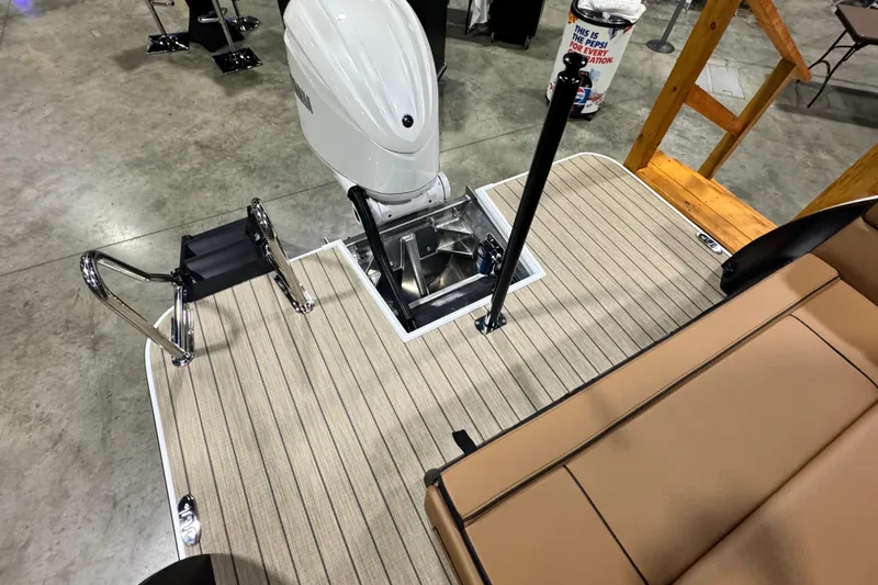 Slide: The Image of 2026 Veranda VX265DCVL boat deck with motor and seating area. - 14