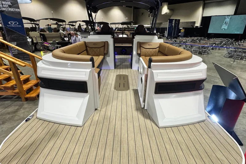 Slide: The Image of 2026 Veranda VX265DCVL pontoon boat with luxurious seating at a boat show. - 4