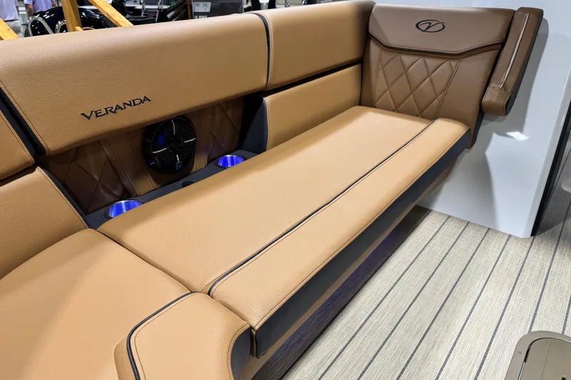 Slide: The Image of Luxurious tan seating in 2026 Veranda VX265DCVL boat, featuring elegant design and integrated speakers. - 6
