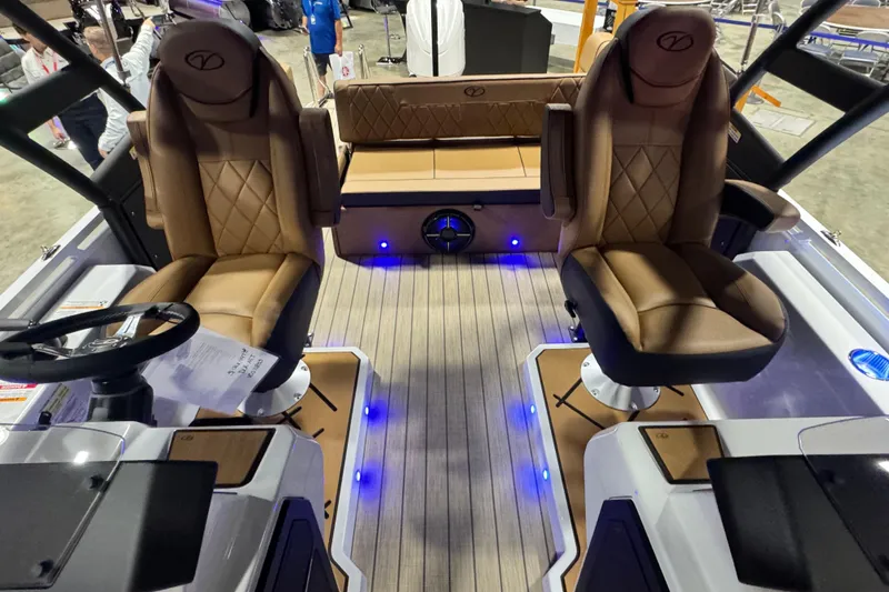 Slide: The Image of Luxurious interior of 2026 Veranda VX265DCVL boat with plush seating and ambient lighting. - 7