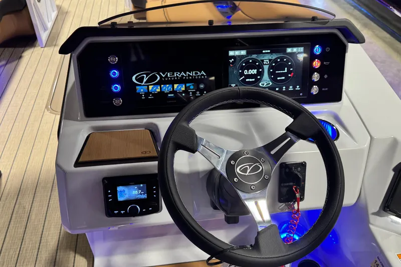 Slide: The Image of Steering console of 2026 Veranda VX265DCVL luxury pontoon with digital displays and controls. - 9