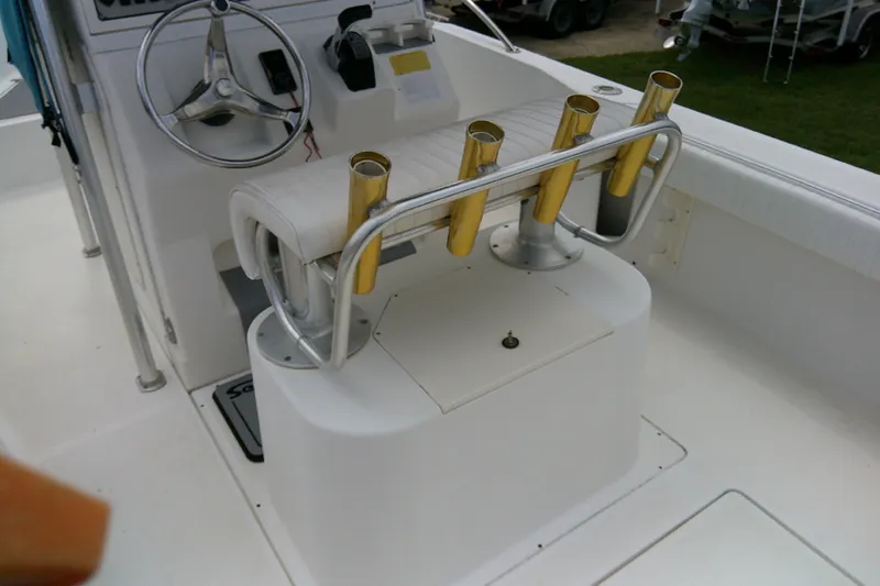 Slide: The Image of 2001 Key West boat interior with steering wheel and rod holders. - 11