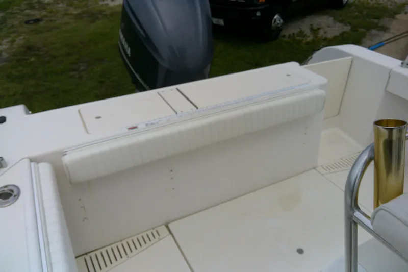 Slide: The Image of 2001 Key West boat interior with white seating and Yamaha outboard motor. - 14