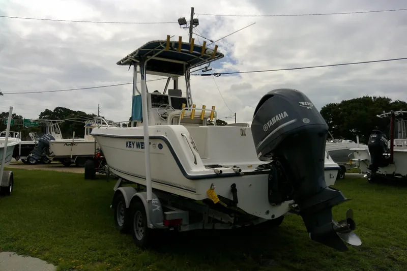 Slide: The Image of 2001 Key West boat with Yamaha engine on trailer, parked outdoors. - 9
