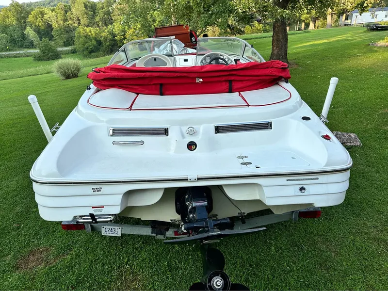 Slide: The Image of 2007 Mariah FS18 boat with red cover on grassy lawn. - 3