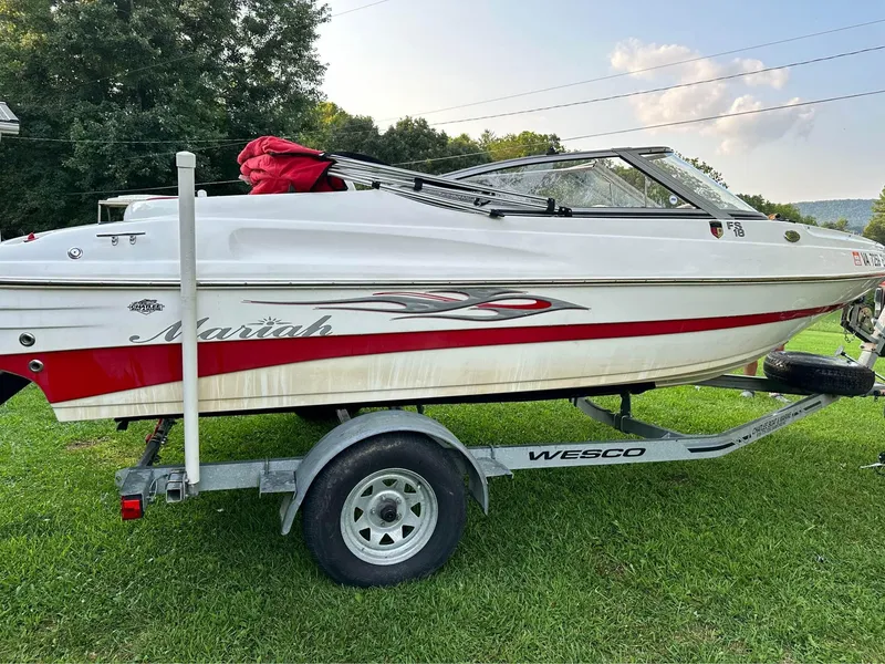 Slide: The Image of 2007 Mariah FS18 boat on Wesco trailer, parked on grass. - 5