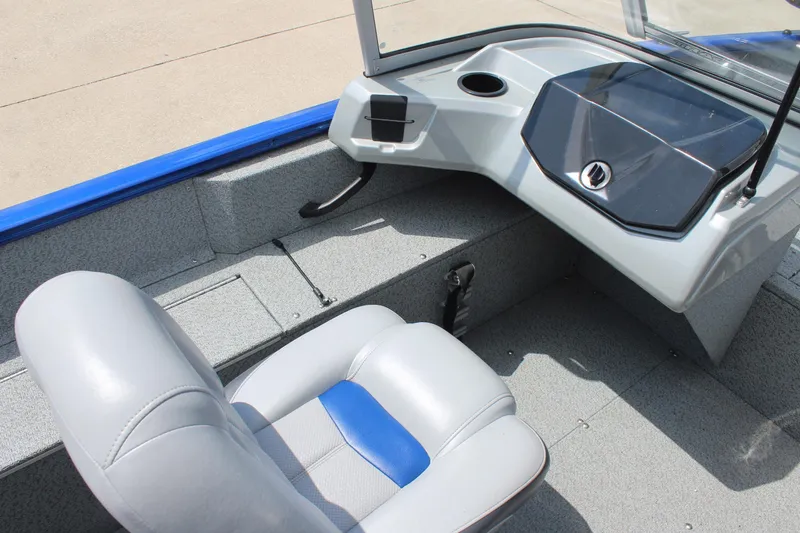 Slide: The Image of 2016 Tracker Pro Guide V-16 WT boat interior with gray seating and control panel. - 10