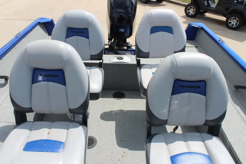Slide: The Image of 2016 Tracker Pro Guide V-16 WT boat interior with four cushioned seats. - 11