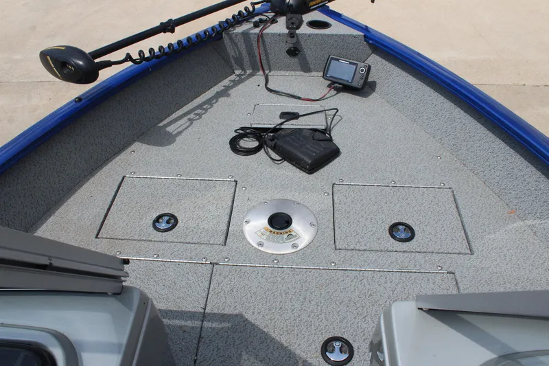 Slide: The Image of 2016 Tracker Pro Guide V-16 WT boat interior with fishing equipment and control panel. - 12