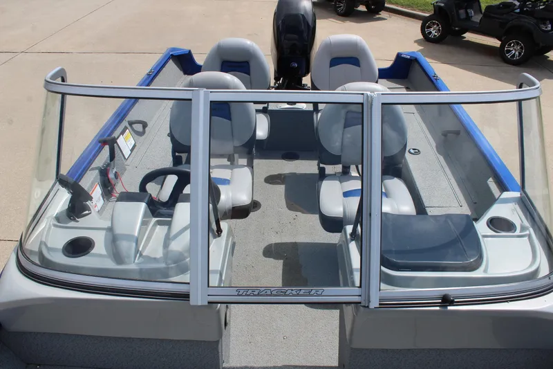 Slide: The Image of 2016 Tracker Pro Guide V-16 WT boat interior with seating and windshield. - 14
