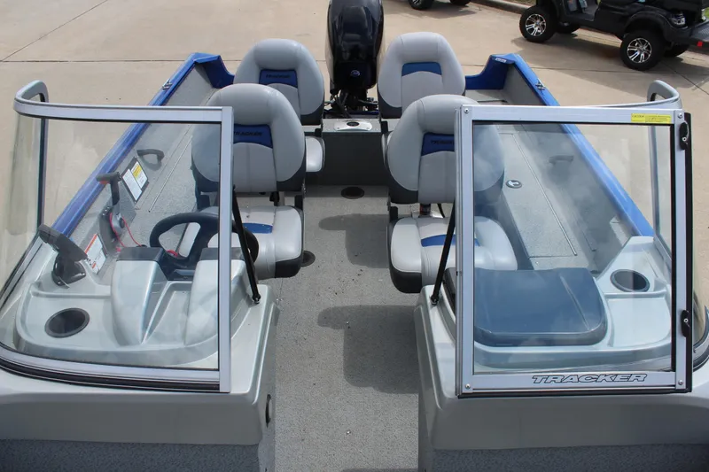 Slide: The Image of 2016 Tracker Pro Guide V-16 WT boat interior with seating and windshield. - 15