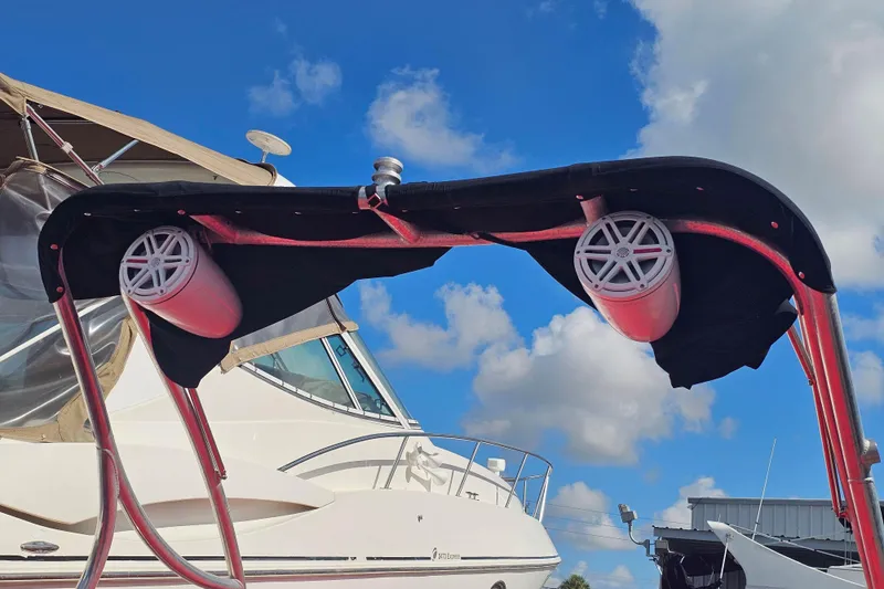 Slide: The Image of 2008 Glastron GT 205 boat with speakers on a sunny day, blue sky background. - 6