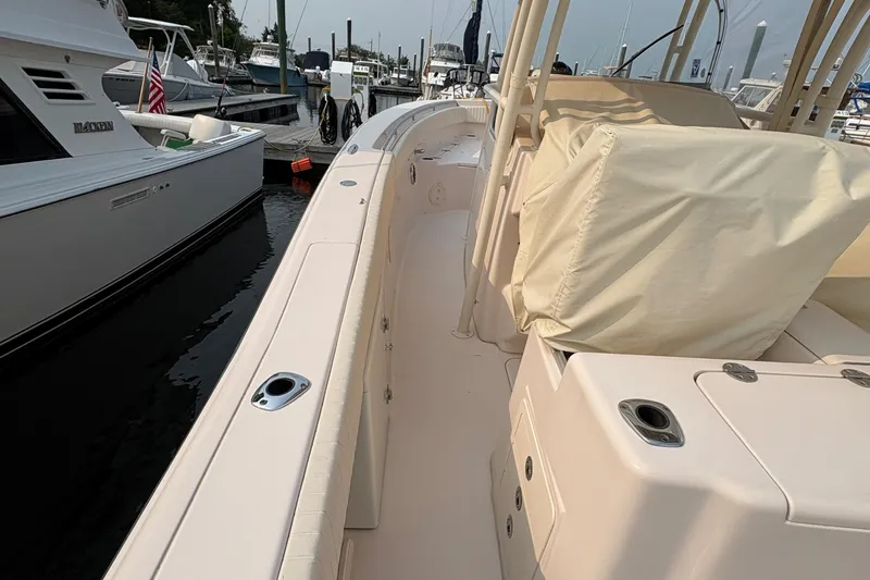 Slide: The Image of 2013 Grady-White Canyon 306 boat docked at marina, side view. - 24
