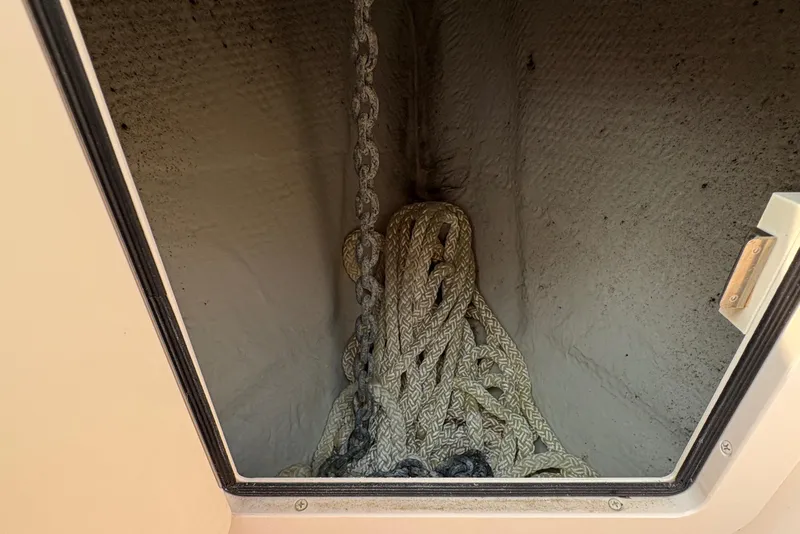 Slide: The Image of Anchor chain and rope storage on 2013 Grady-White Canyon 306 boat. - 29