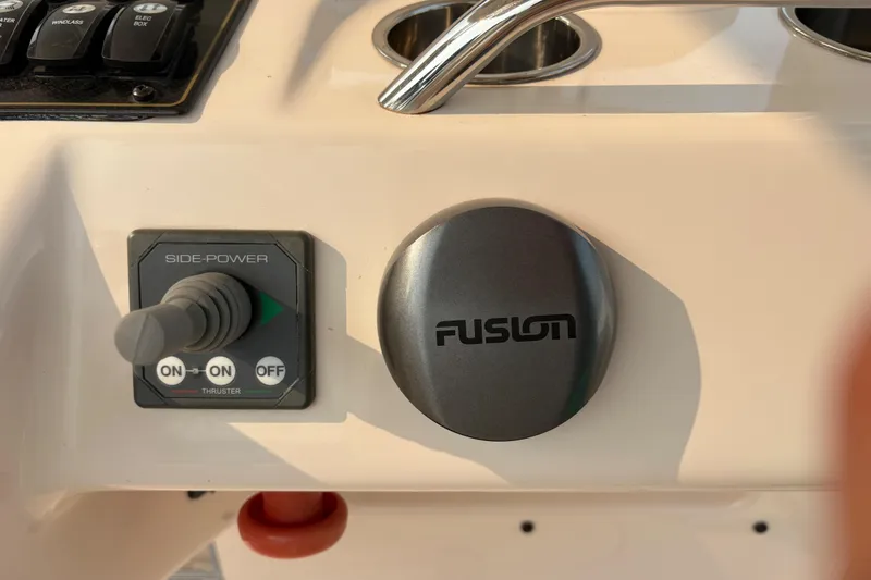 Slide: The Image of Control panel of a 2013 Grady-White Canyon 306 boat with Fusion audio system. - 43