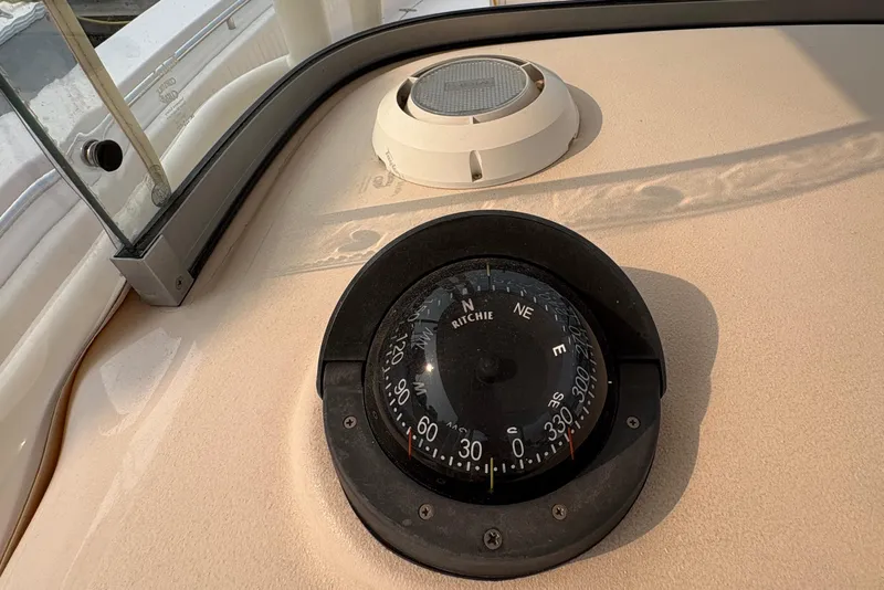 Slide: The Image of Compass on 2013 Grady-White Canyon 306 boat dashboard, showing navigation details. - 46