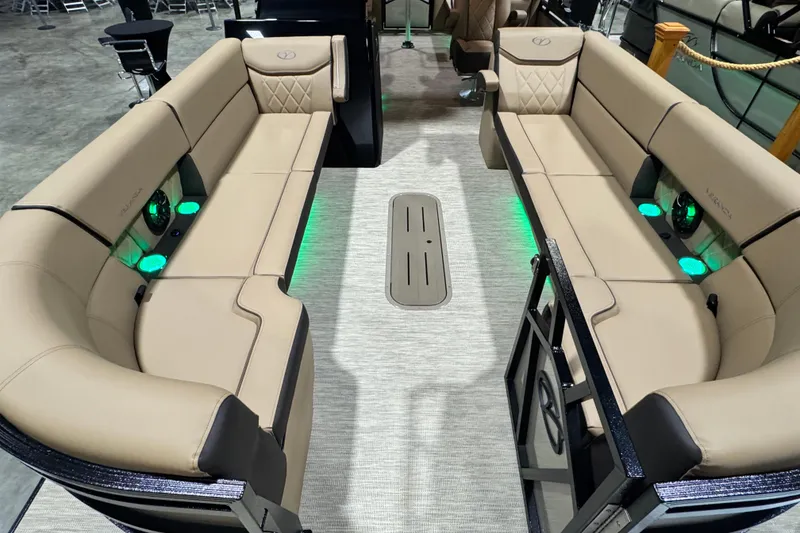 Slide: The Image of Luxurious 2026 Veranda VX25RC pontoon boat interior with beige seating and ambient lighting. - 4