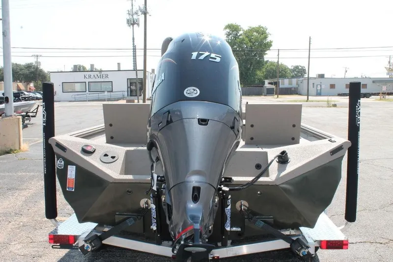 Slide: The Image of 2026 Excel Bay Pro Elite 220 boat with Yamaha 175 engine, parked on a trailer. - 3