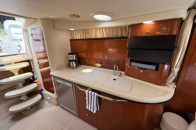 Slide: The Image of Luxurious 2003 Sea Ray 340 Sundancer yacht interior with modern kitchen amenities. - 29