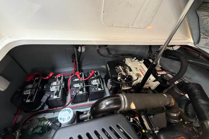 Slide: The Image of Engine compartment of 2003 Sea Ray 340 Sundancer with batteries and wiring visible. - 39