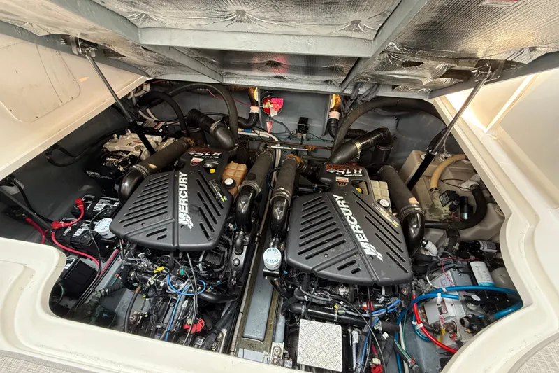 Slide: The Image of Engine compartment of a 2003 Sea Ray 340 Sundancer with twin Mercury engines. - 40