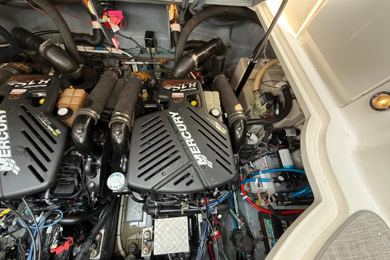 Slide: The Image of Engine compartment of a 2003 Sea Ray 340 Sundancer with Mercury engines. - 41