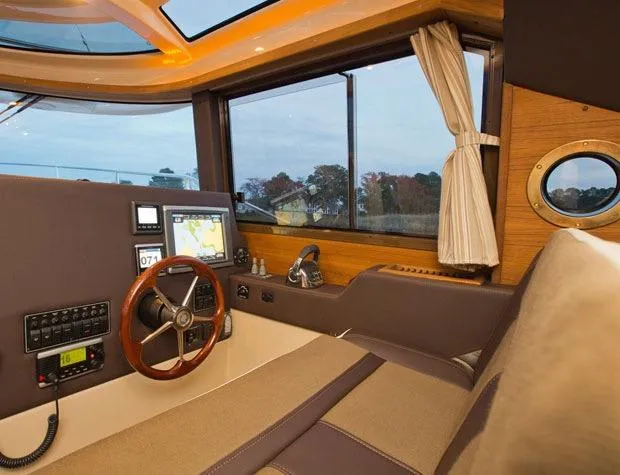 Slide: The Image of Manufacturer Provided Image: Interior of 2025 Ranger Tugs R-29 S with modern helm and navigation equipment. - 11