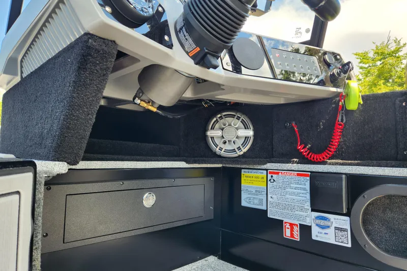 Slide: The Image of 2026 Smoker Craft Adventurer 188 DC PRO boat interior with control panel and safety features. - 11