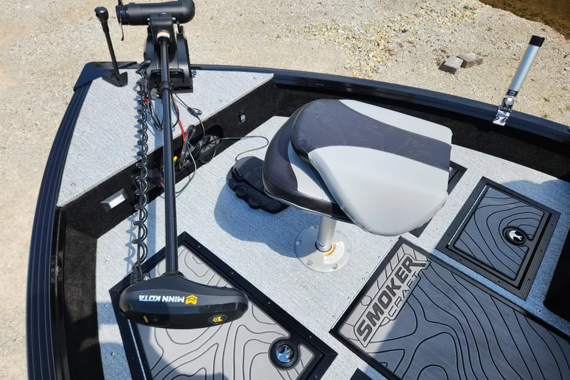 Slide: The Image of 2026 Smoker Craft Adventurer 188 DC PRO boat interior with seat and trolling motor. - 15