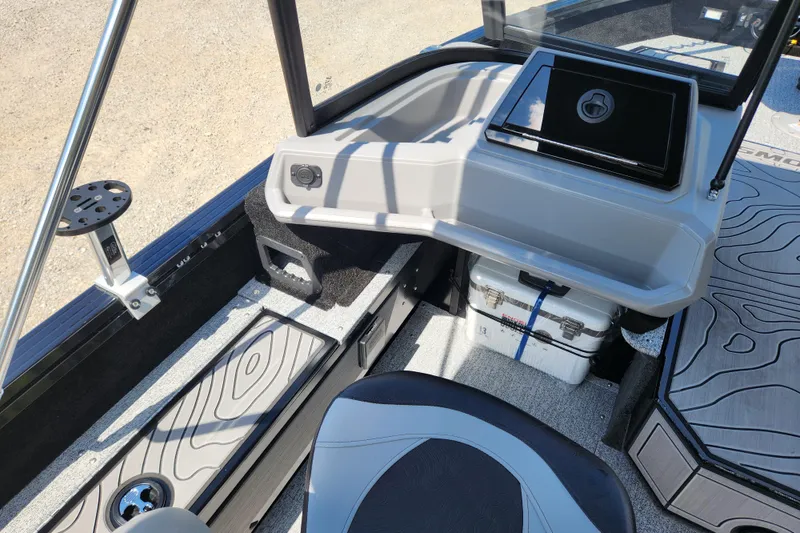 Slide: The Image of 2026 Smoker Craft Adventurer 188 DC PRO boat interior with modern dashboard and seating. - 28