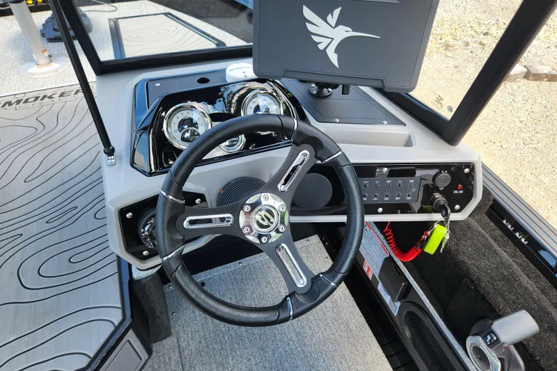 Slide: The Image of Steering console of 2026 Smoker Craft Adventurer 188 DC PRO boat, featuring modern controls and dashboard. - 36