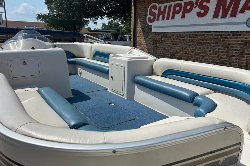 Slide: The Image of 2003 Hurricane FD228REF boat interior with blue and white seating, displayed at Shipp's Marine. - 3