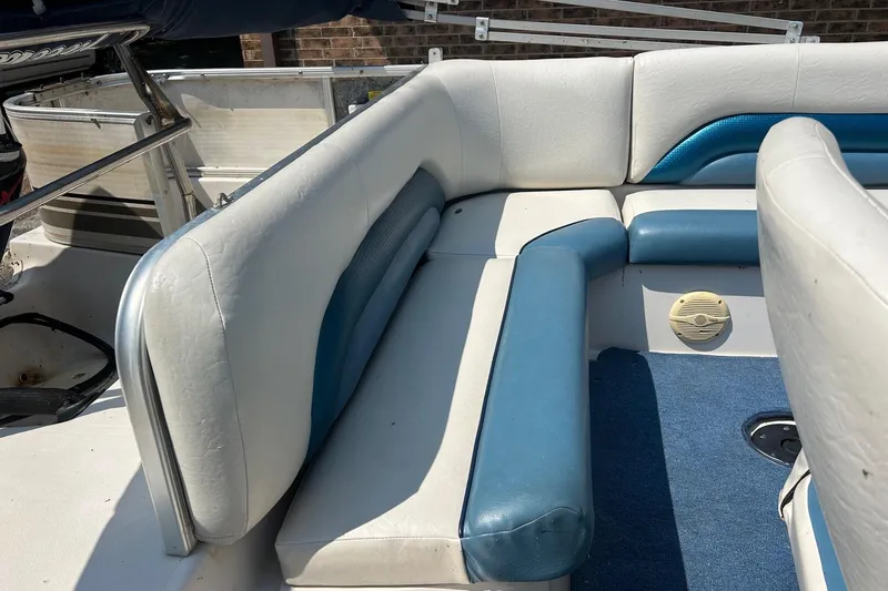 Slide: The Image of Interior seating of a 2003 Hurricane FD228REF boat with blue and white upholstery. - 8