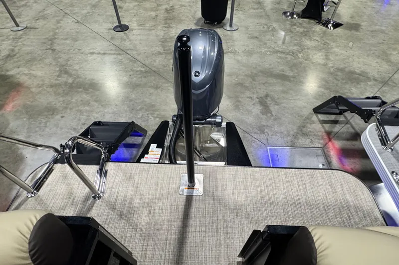 Slide: The Image of 2026 Veranda Relax VR22RC boat interior with motor, displayed on concrete floor. - 10