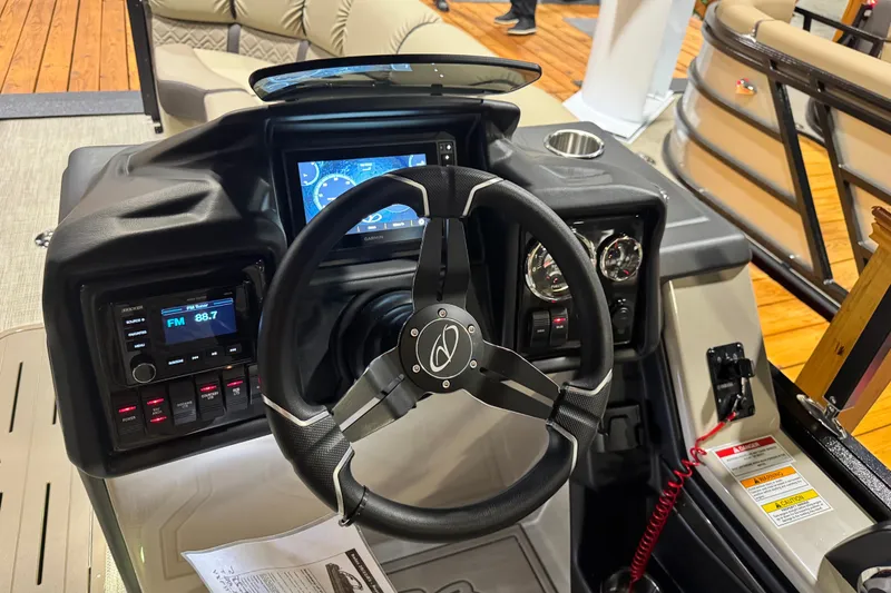 Slide: The Image of Steering console of 2026 Veranda Relax VR22RC pontoon boat with modern controls and displays. - 6