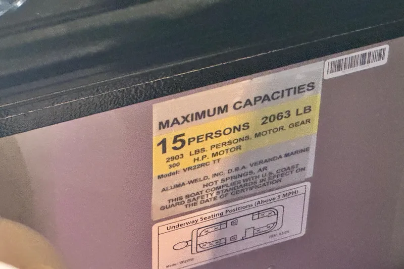 Slide: The Image of Capacity label on Veranda Relax VR22RC boat, 2026 model, showing 15-person, 2063 lb limit. - 7