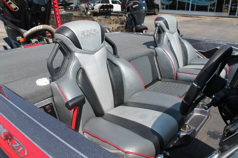 Slide: The Image of 2022 Skeeter FXR21 Apex boat interior with sleek, modern seating and steering wheel. - 10